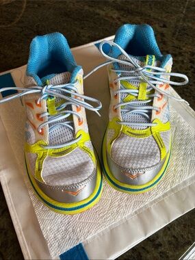 Hoka Women’s Athletic Shoes in Neon Yellow, Blue & Silver